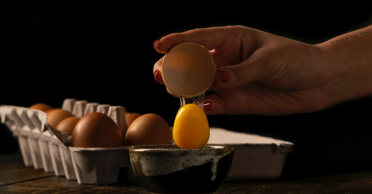 How do I prevent an egg cracking while hard boiling it? - Person Cracking an Egg on a Bowl How do I prevent an egg cracking while hard boiling it? - Person Cracking an Egg on a Bowl