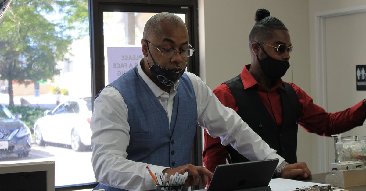 How do I promade - Man Using an iPad Beside His Friend How do I promade - Man Using an iPad Beside His Friend