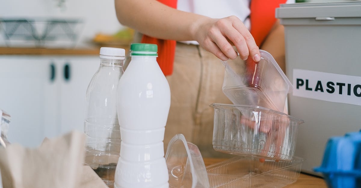How do I remove bloomy rind without wasting too much cheese? - Woman sorting out plastic wastes at home How do I remove bloomy rind without wasting too much cheese? - Woman sorting out plastic wastes at home