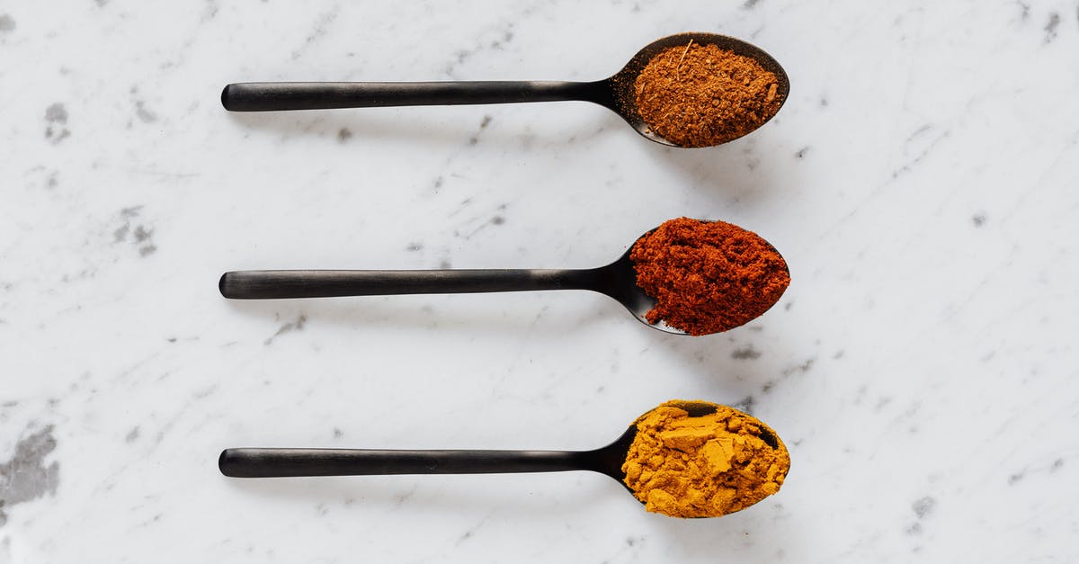 How do I remove turmeric stains from metal/plastic cookware? - Top view of dry curcuma with smoked paprika and mix of ground peppers on plastic spoons on marble table How do I remove turmeric stains from metal/plastic cookware? - Top view of dry curcuma with smoked paprika and mix of ground peppers on plastic spoons on marble table