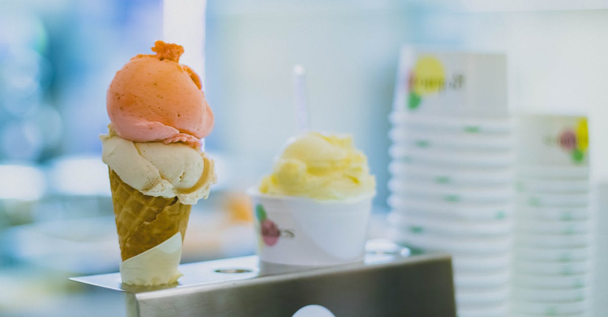 How do I scoop ice cream into spherical scoops every time? - Ice Cream on Cone With Gray Metallic Holder Photo