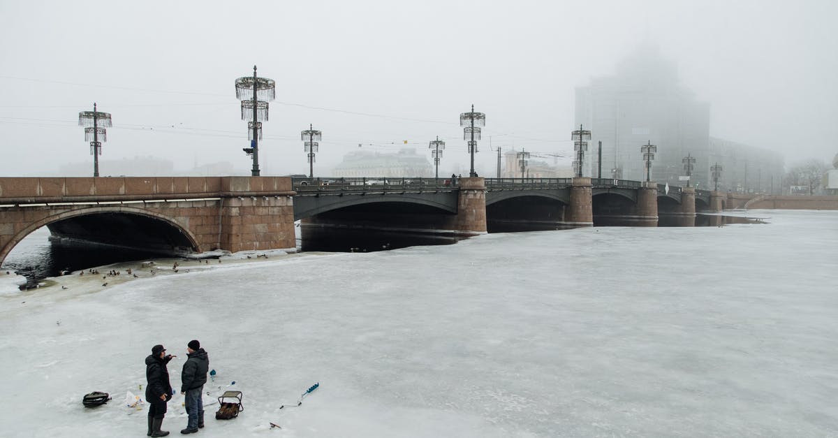 How do I separate two fish fillets that have been frozen together? - Unrecognizable fishermen on river with ice How do I separate two fish fillets that have been frozen together? - Unrecognizable fishermen on river with ice