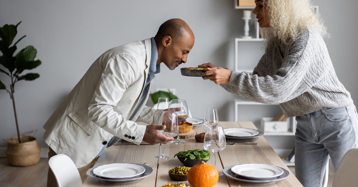 How do I soften home made Split Pea with crunchy Peas? - Side view of African American man smelling fresh meal while standing at served table with dishware and food with black wife How do I soften home made Split Pea with crunchy Peas? - Side view of African American man smelling fresh meal while standing at served table with dishware and food with black wife