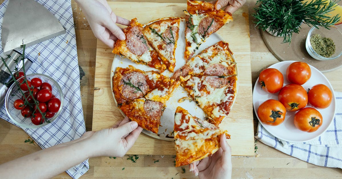 How do I tell if my cheese culture is still good? - Crop friends taking slices of delicious pizza from cutting board How do I tell if my cheese culture is still good? - Crop friends taking slices of delicious pizza from cutting board