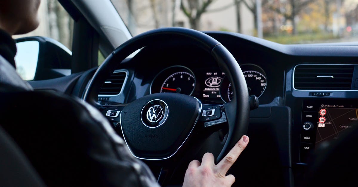 How do I turn on an auto ignition stove? - Back view of crop anonymous male driving contemporary transport while turning steering wheel in daylight How do I turn on an auto ignition stove? - Back view of crop anonymous male driving contemporary transport while turning steering wheel in daylight