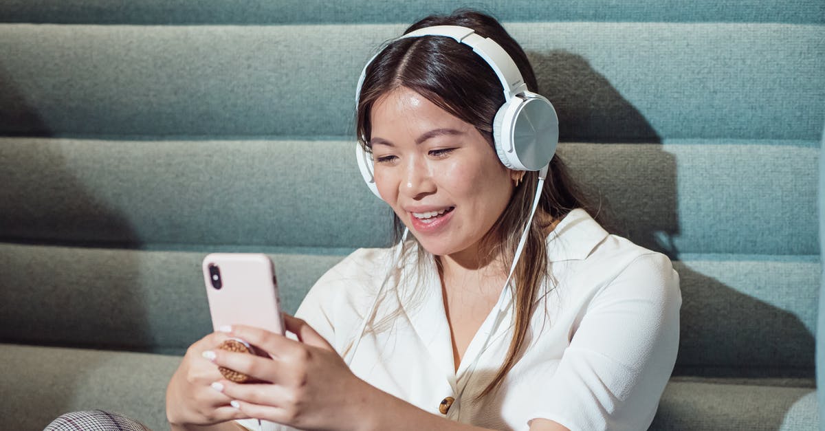 How do I use a Chinese spoon? - Woman Using Smartphone while Listening to Music How do I use a Chinese spoon? - Woman Using Smartphone while Listening to Music
