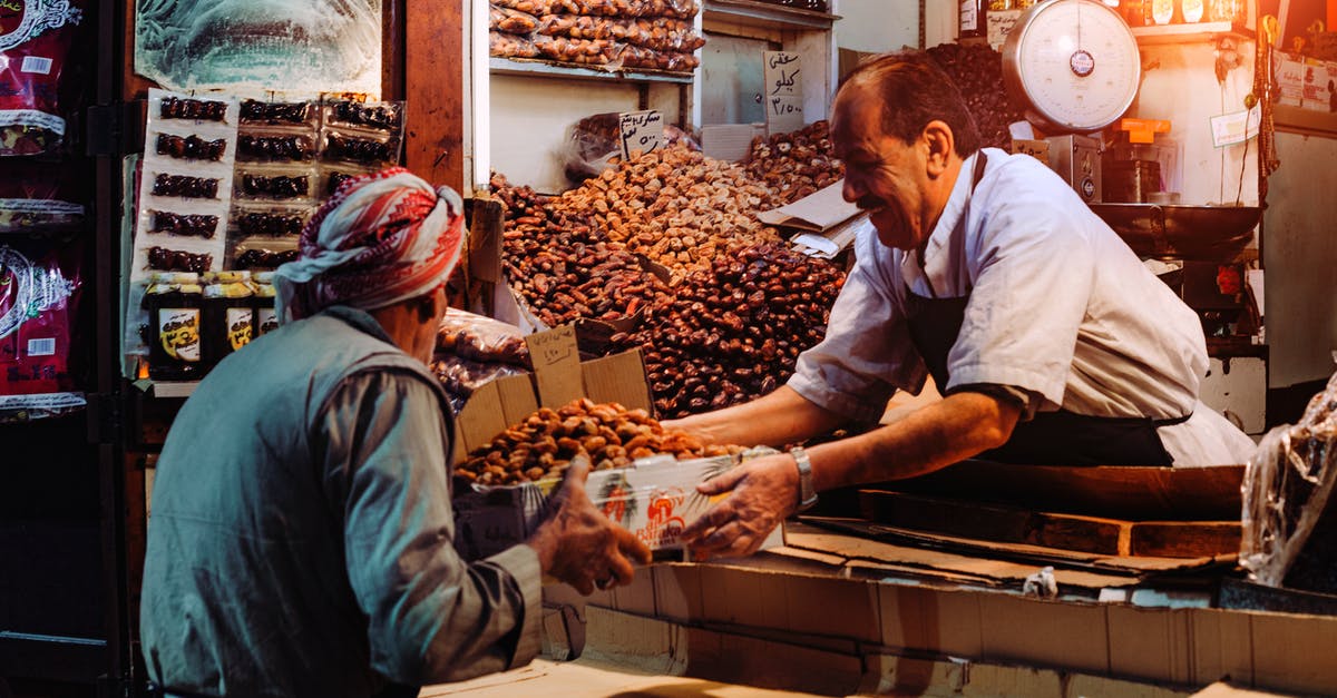 How do I work out the use-by dates for my own cooking? - Man in Blue Top Giving Box to Man in Gray Top How do I work out the use-by dates for my own cooking? - Man in Blue Top Giving Box to Man in Gray Top
