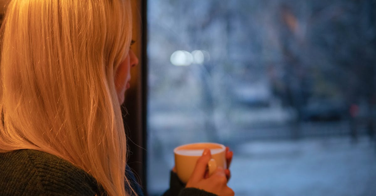 How do they get caffeine out in decaffeinated coffee? - Woman in Black Knit Long-sleeved Shirt Holding White Ceramic Mug How do they get caffeine out in decaffeinated coffee? - Woman in Black Knit Long-sleeved Shirt Holding White Ceramic Mug