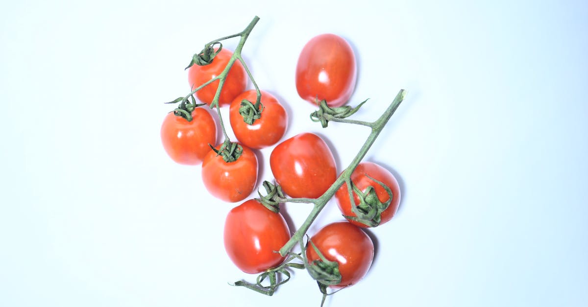 How do tomatillos differ in taste from under-ripe tomatoes? - Heap of red tomatoes on branch How do tomatillos differ in taste from under-ripe tomatoes? - Heap of red tomatoes on branch