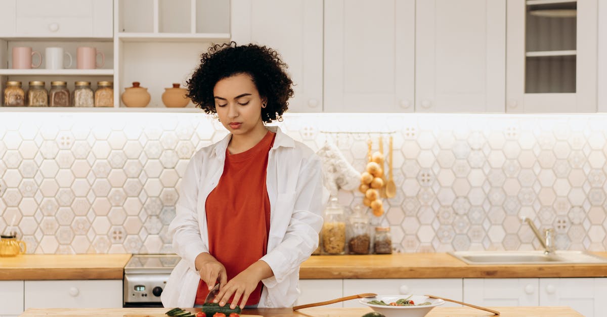 How do you bring ingredients to room temperature when its winter? - Woman in White Blazer Holding Knife Slicing Cucumber How do you bring ingredients to room temperature when its winter? - Woman in White Blazer Holding Knife Slicing Cucumber