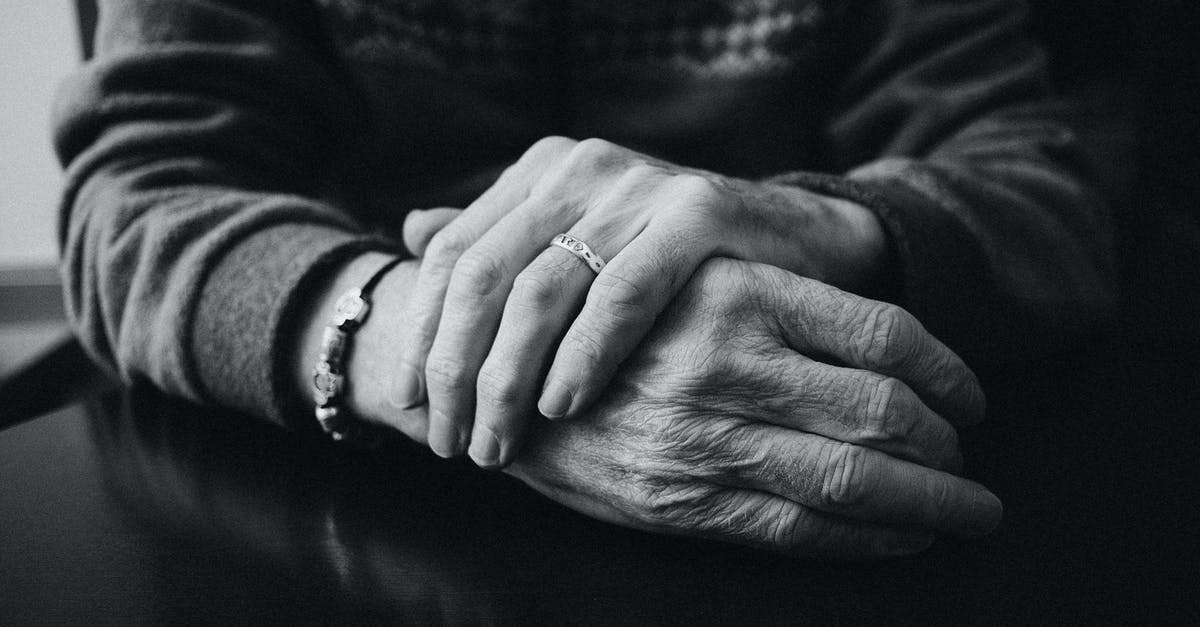How do you dispose of old raisins? [closed] - Grayscale Photo of a Person Wearing Ring