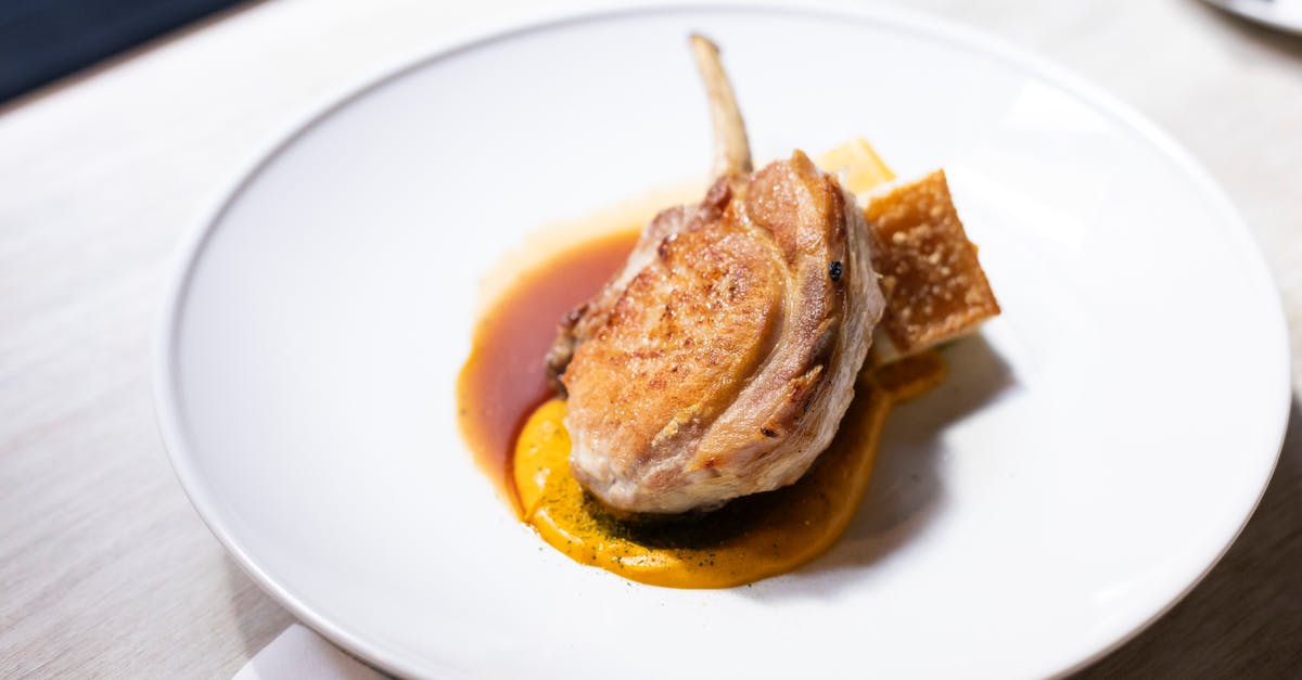 How do you french trim a lamb shank? - From above of appetizing roasted lamb shank garnished with sauce and served on white ceramic plate in restaurant How do you french trim a lamb shank? - From above of appetizing roasted lamb shank garnished with sauce and served on white ceramic plate in restaurant