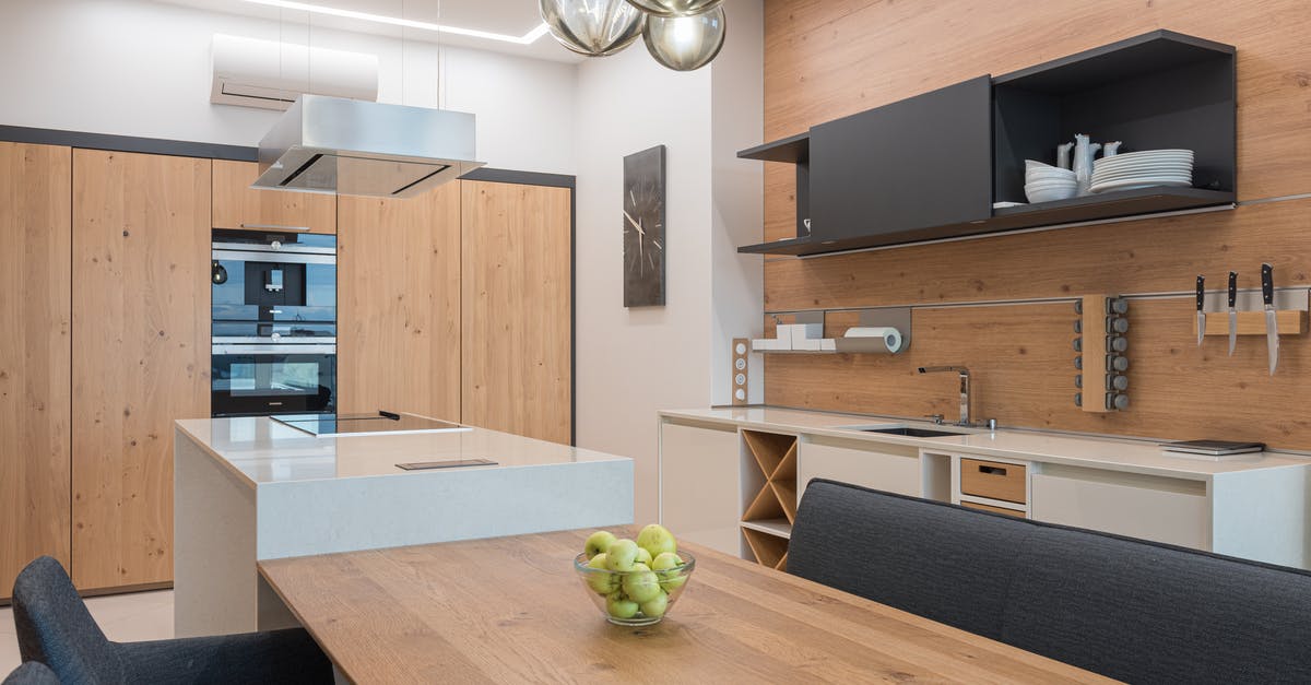 How do you make a smooth and creamy apple custard? - Modern kitchen with black cupboard and brown table How do you make a smooth and creamy apple custard? - Modern kitchen with black cupboard and brown table