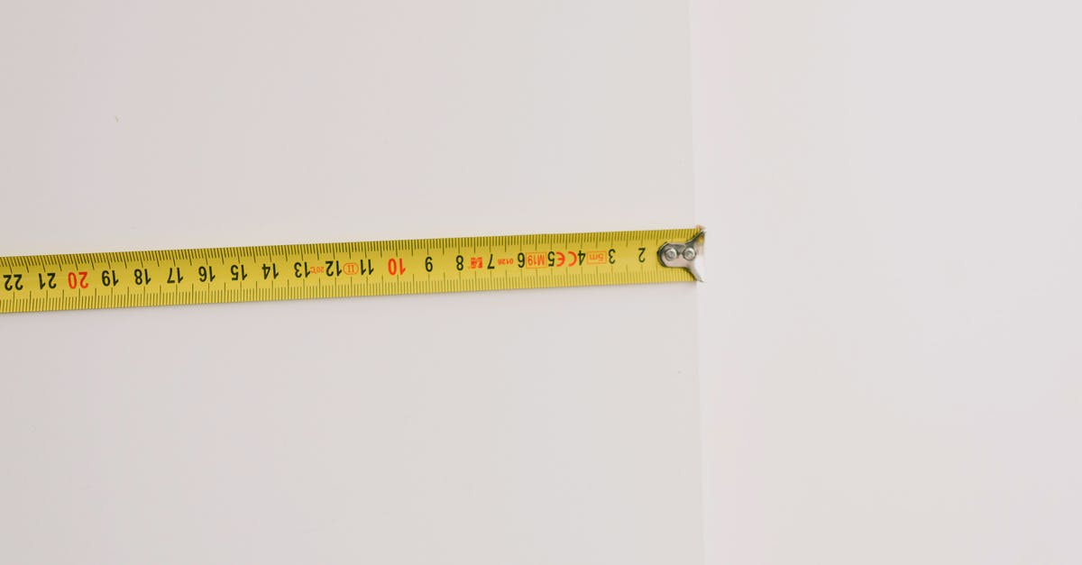 How do you prepare squid tentacles? - Measuring tape on empty white background How do you prepare squid tentacles? - Measuring tape on empty white background