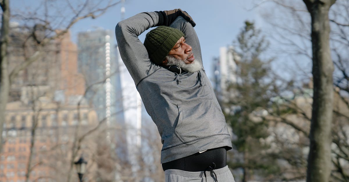 How do you raise your dough in cold seasons? - Senior black male doing exercise in park in fall How do you raise your dough in cold seasons? - Senior black male doing exercise in park in fall