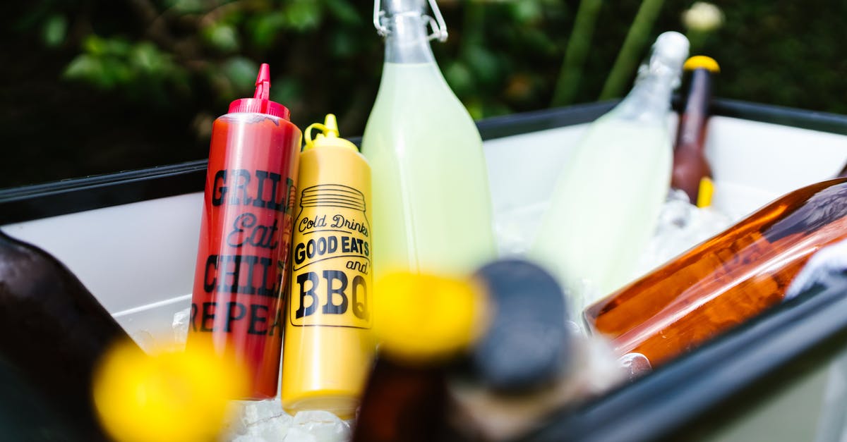 How do you safely bottle or "can" bbq meat drippings? - Clear Glass Bottle With Yellow Liquid Inside