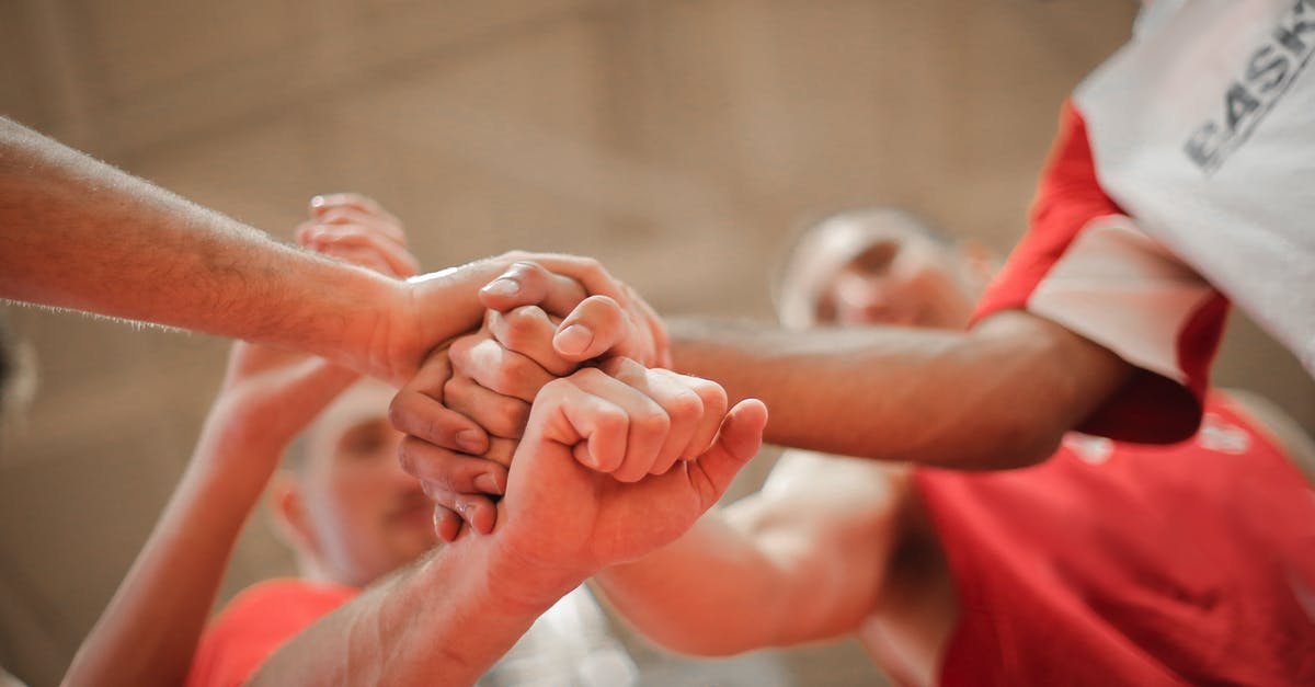 How do you separate the skin from pork? - From below of crop multiethnic team of professional basketball players gathering and putting hands together while standing on playground before game How do you separate the skin from pork? - From below of crop multiethnic team of professional basketball players gathering and putting hands together while standing on playground before game