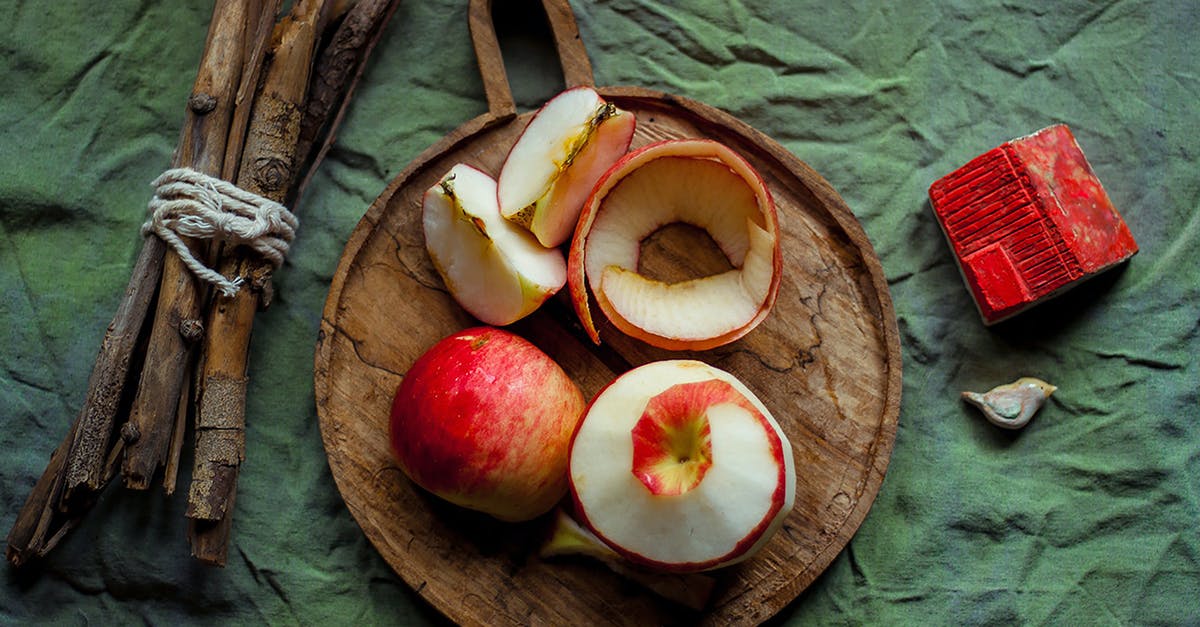 How do you store away freshly peeled and sliced potatoes? [duplicate] - Sliced Apple Fruit on Brown Wooden Round Plate