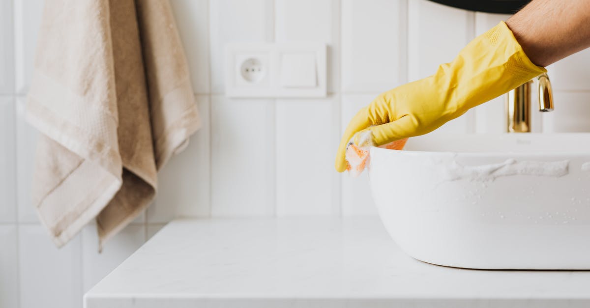 How does a sourdough sponge work? - Crop anonymous person wearing yellow latex gloves washing sink in bathroom with orange sponge and cleanser while cleaning contemporary flat How does a sourdough sponge work? - Crop anonymous person wearing yellow latex gloves washing sink in bathroom with orange sponge and cleanser while cleaning contemporary flat