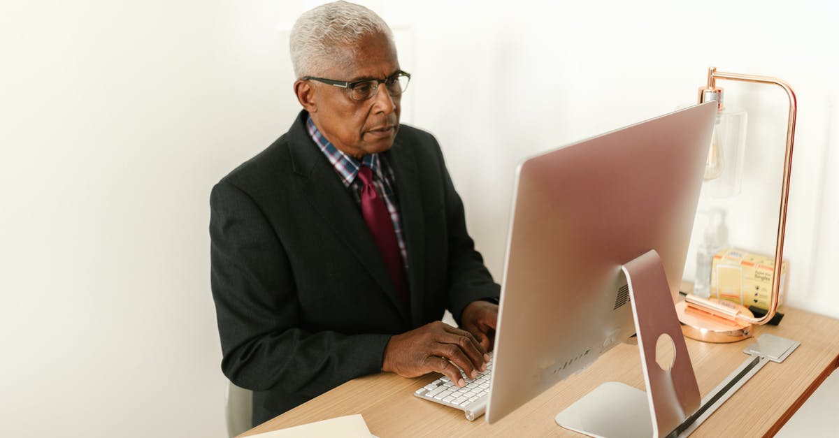 How does aging affect Gouda cheese? - Man in Black Suit Jacket Using Macbook How does aging affect Gouda cheese? - Man in Black Suit Jacket Using Macbook