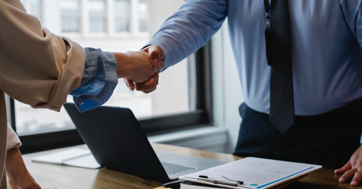 How does deglazing work? - Crop unrecognizable coworkers in formal wear standing at table with laptop and documents while greeting each other before meeting How does deglazing work? - Crop unrecognizable coworkers in formal wear standing at table with laptop and documents while greeting each other before meeting