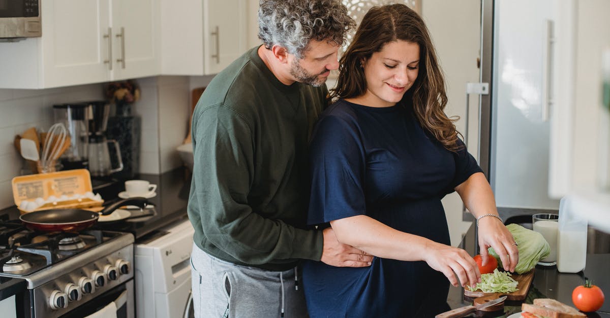 How does double-bagging sous vide food affect cook time? - Calm husband embracing pregnant wife preparing tasty sandwiches while spending time together in kitchen in cozy apartment in daytime How does double-bagging sous vide food affect cook time? - Calm husband embracing pregnant wife preparing tasty sandwiches while spending time together in kitchen in cozy apartment in daytime
