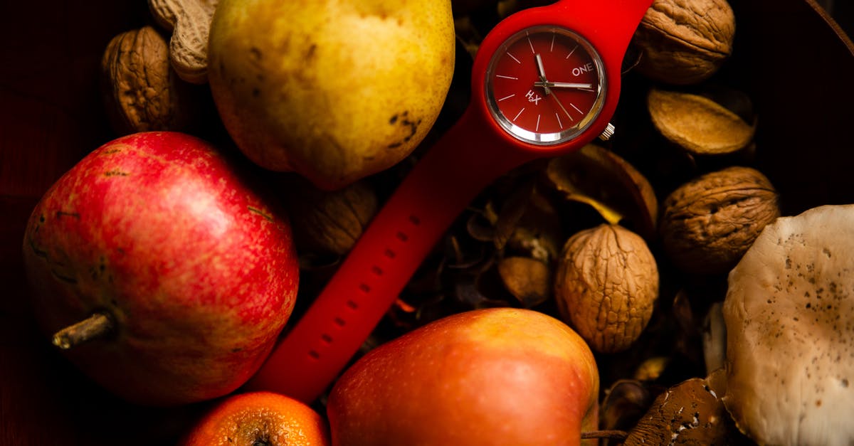 How does harvest time matter with tea? - From above of red rubber wristwatch placed in healthy basket with organic fresh apples pear and orange and composed with different nuts How does harvest time matter with tea? - From above of red rubber wristwatch placed in healthy basket with organic fresh apples pear and orange and composed with different nuts