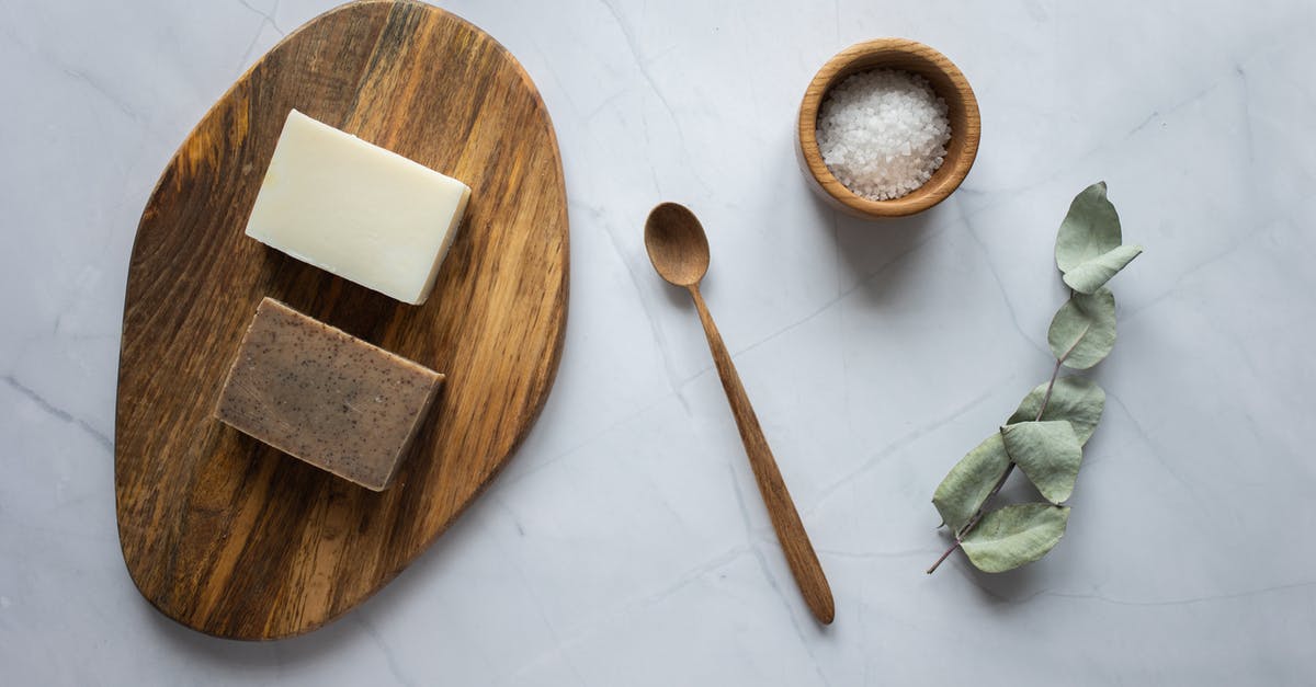 How does preserved lemons salt soultion form a gel? - Homemade soap on wooden board near scrub with salt How does preserved lemons salt soultion form a gel? - Homemade soap on wooden board near scrub with salt