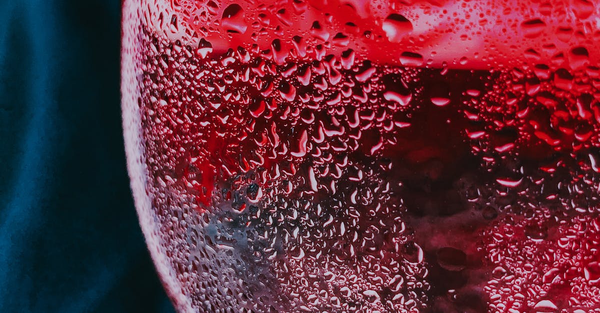 How does red wine butter impact the flavor of dishes? - Closeup of water drops on misted glass of cold red fizzy cocktail served on table How does red wine butter impact the flavor of dishes? - Closeup of water drops on misted glass of cold red fizzy cocktail served on table