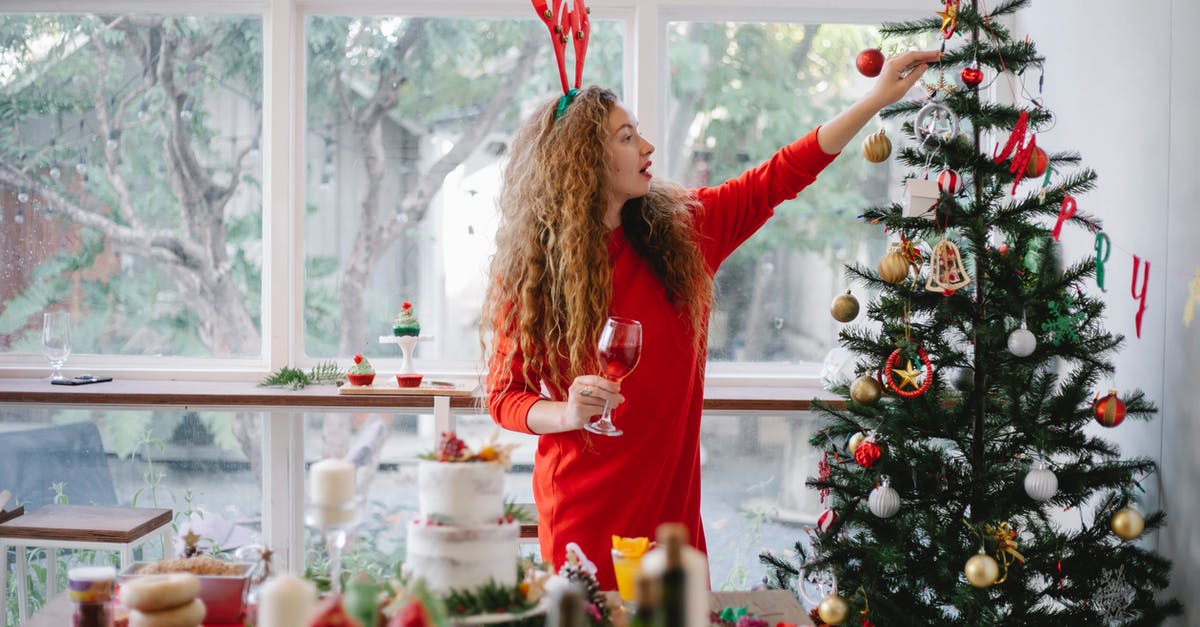 How does red wine butter impact the flavor of dishes? - Woman in headband with reindeer decorating Christmas tree How does red wine butter impact the flavor of dishes? - Woman in headband with reindeer decorating Christmas tree