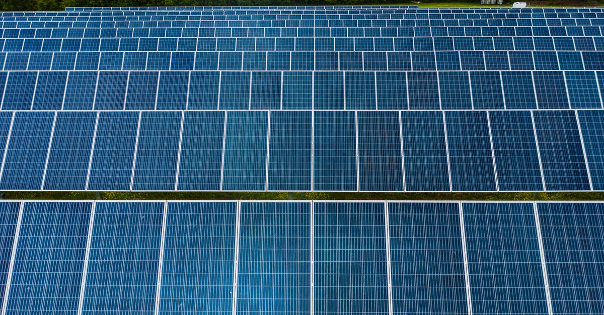 How does the industry conserve their smoothies - Contemporary installation of solar panels mounted on field in environmental friendly solar power station How does the industry conserve their smoothies - Contemporary installation of solar panels mounted on field in environmental friendly solar power station