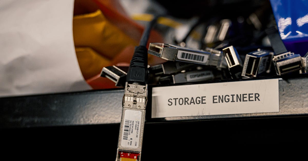 How does the power setting on a microwave work? - Low angle of various connectors and USB cables placed on shelf with storage engineer inscription