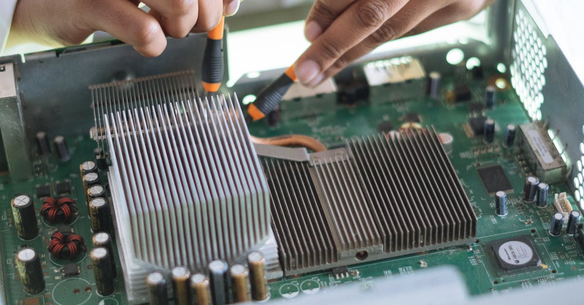 How does the USDA grading system work? - Crop technician checking contacts on motherboard in workshop