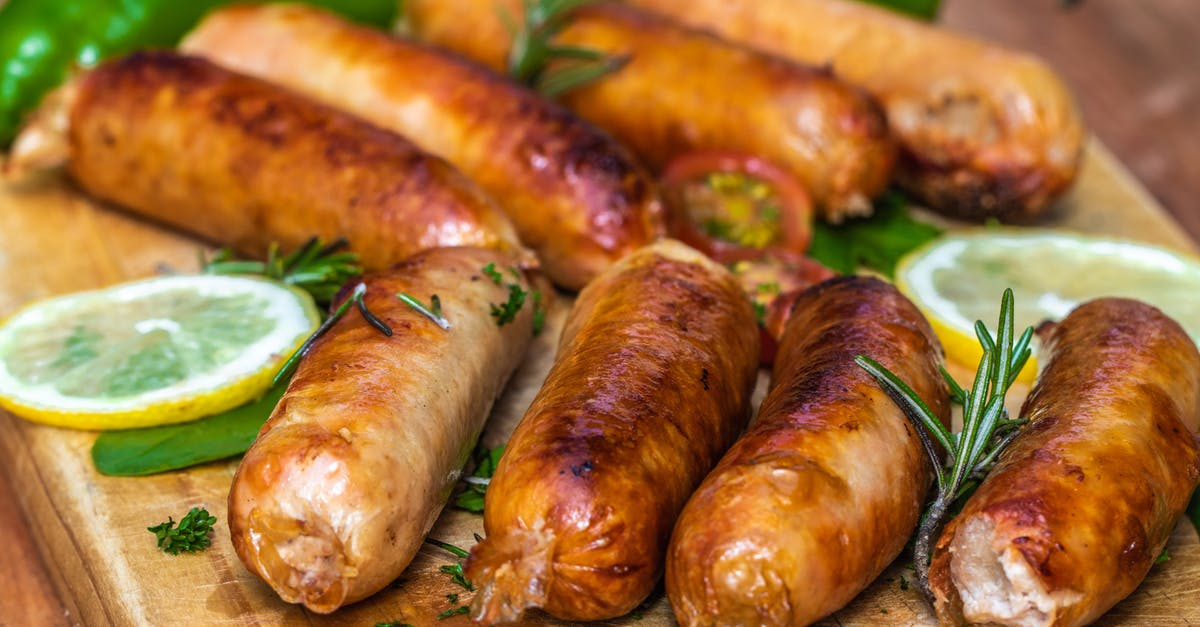 How hot does garlic need to get to lose its sharpness? - Cooked Sausages In Close-Up View How hot does garlic need to get to lose its sharpness? - Cooked Sausages In Close-Up View