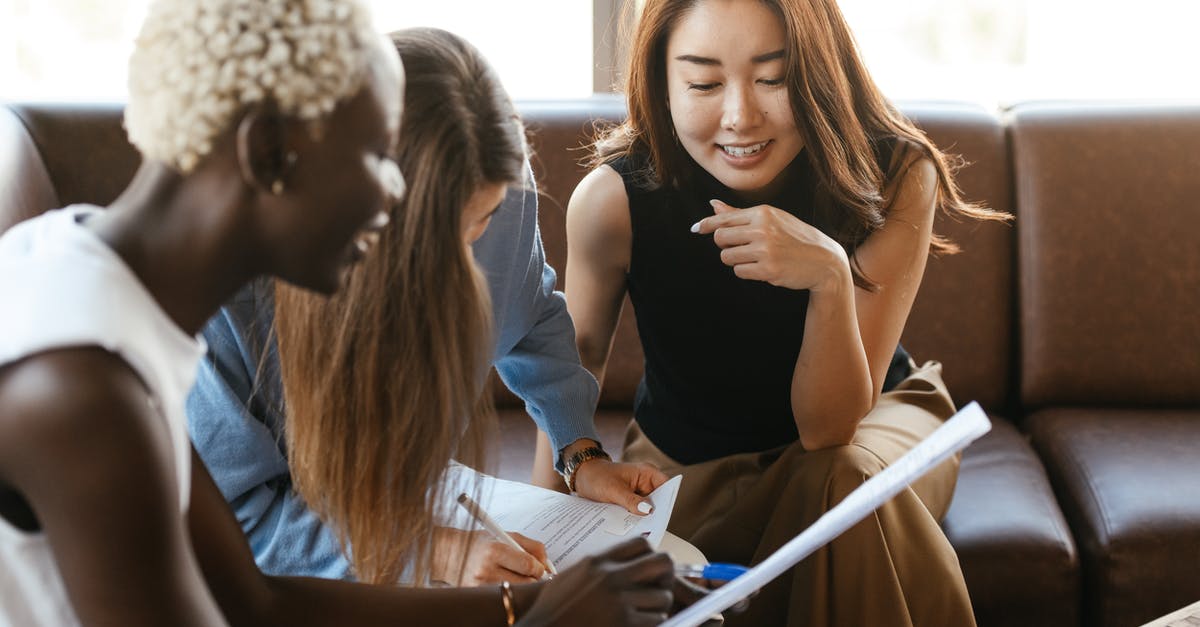 How important is RPM in a blender? - Multiethnic cheerful colleagues talking about job and working with documents How important is RPM in a blender? - Multiethnic cheerful colleagues talking about job and working with documents