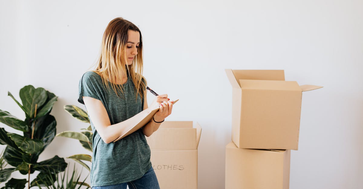 How important is RPM in a blender? - Focused young lady in casual wear taking notes in clipboard while standing near packed carton boxes before moving into new house How important is RPM in a blender? - Focused young lady in casual wear taking notes in clipboard while standing near packed carton boxes before moving into new house