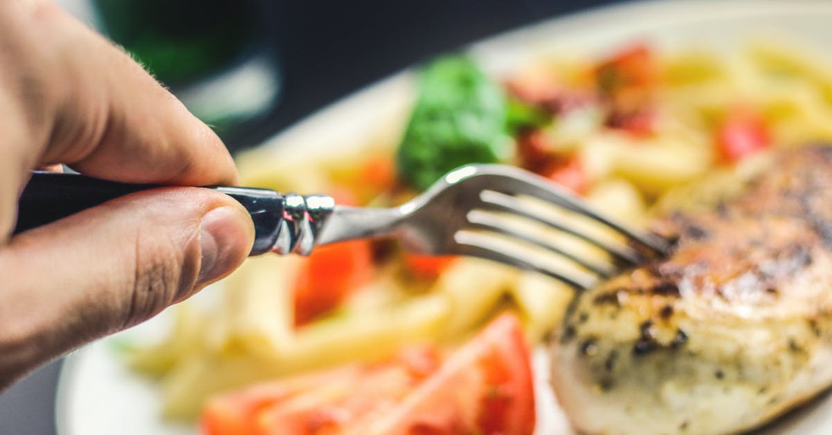 How is rare steak made safe to eat? - Person Holding Silver Fork How is rare steak made safe to eat? - Person Holding Silver Fork