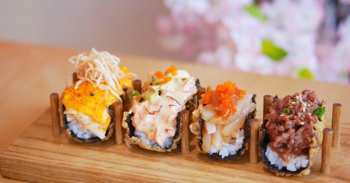 How is sushi supposed to be eaten? - Sushi on Wooden Tray How is sushi supposed to be eaten? - Sushi on Wooden Tray