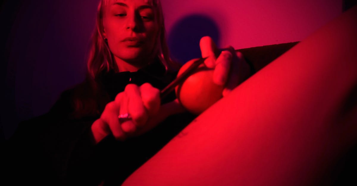 How long can chicken stay out raw at room temperature before becoming unedible? [duplicate] - From below of concentrated young female in black wear cutting fruit with sharp knife in dark room illuminated with red neon light