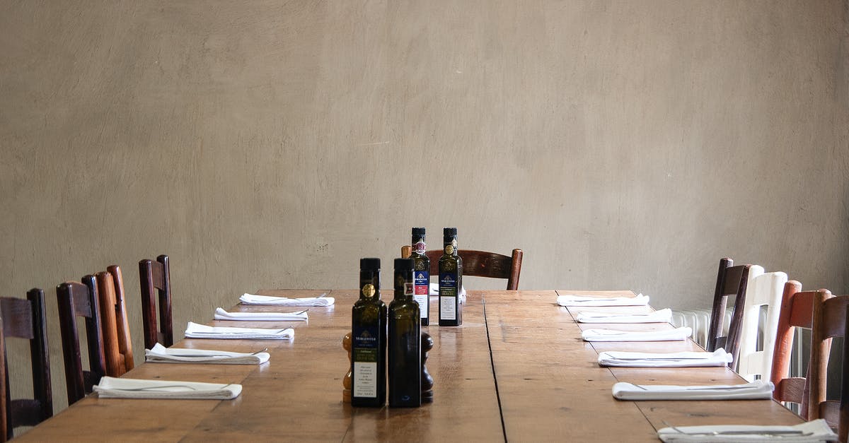How long can you keep tuna in jar with olive oil - Wooden table with bottles of olive oil and cutlery How long can you keep tuna in jar with olive oil - Wooden table with bottles of olive oil and cutlery