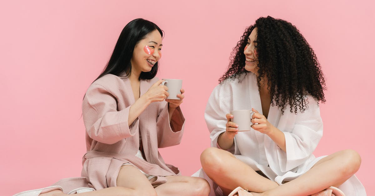 How long do black olives last once opened? - Two women in bathrobes sitting on floor and having break with cup of tea