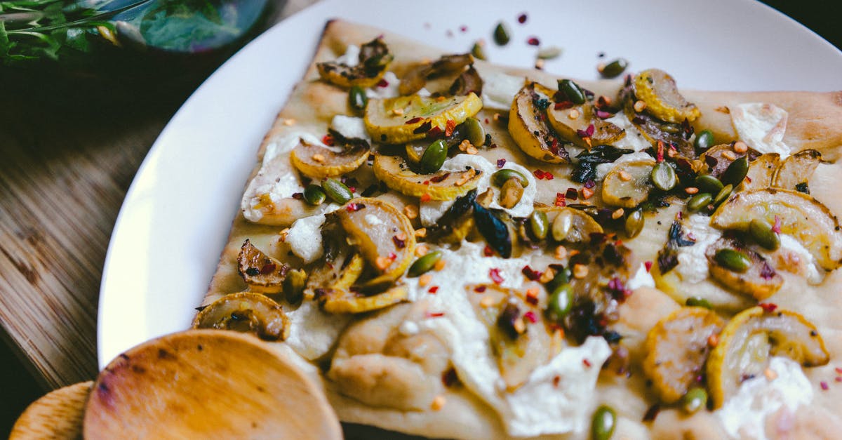 How long does cooked garlic keep in fridge? - Pizza Slice on White Ceramic Plate How long does cooked garlic keep in fridge? - Pizza Slice on White Ceramic Plate