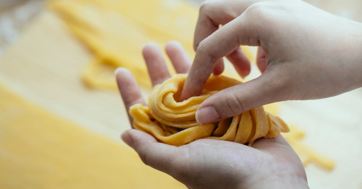 How long does cooked pasta last in the fridge? - Woman making homemade pasta with egg dough How long does cooked pasta last in the fridge? - Woman making homemade pasta with egg dough