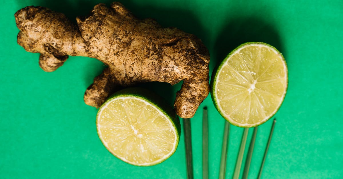 How long does ginger root last? - Ginger Root and Lime Halves on a Green Surface How long does ginger root last? - Ginger Root and Lime Halves on a Green Surface