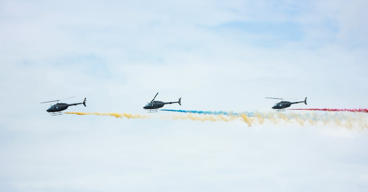 How long does it take to smoke a chicken? - From below of identical black helicopters with long tails and propellers flying in cloudy sky while leaving colorful wavy traces with smoke effect in daylight How long does it take to smoke a chicken? - From below of identical black helicopters with long tails and propellers flying in cloudy sky while leaving colorful wavy traces with smoke effect in daylight