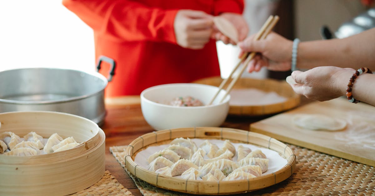 How long does raw ground meat last in the fridge? - Crop woman with relative filling dim sum in kitchen How long does raw ground meat last in the fridge? - Crop woman with relative filling dim sum in kitchen