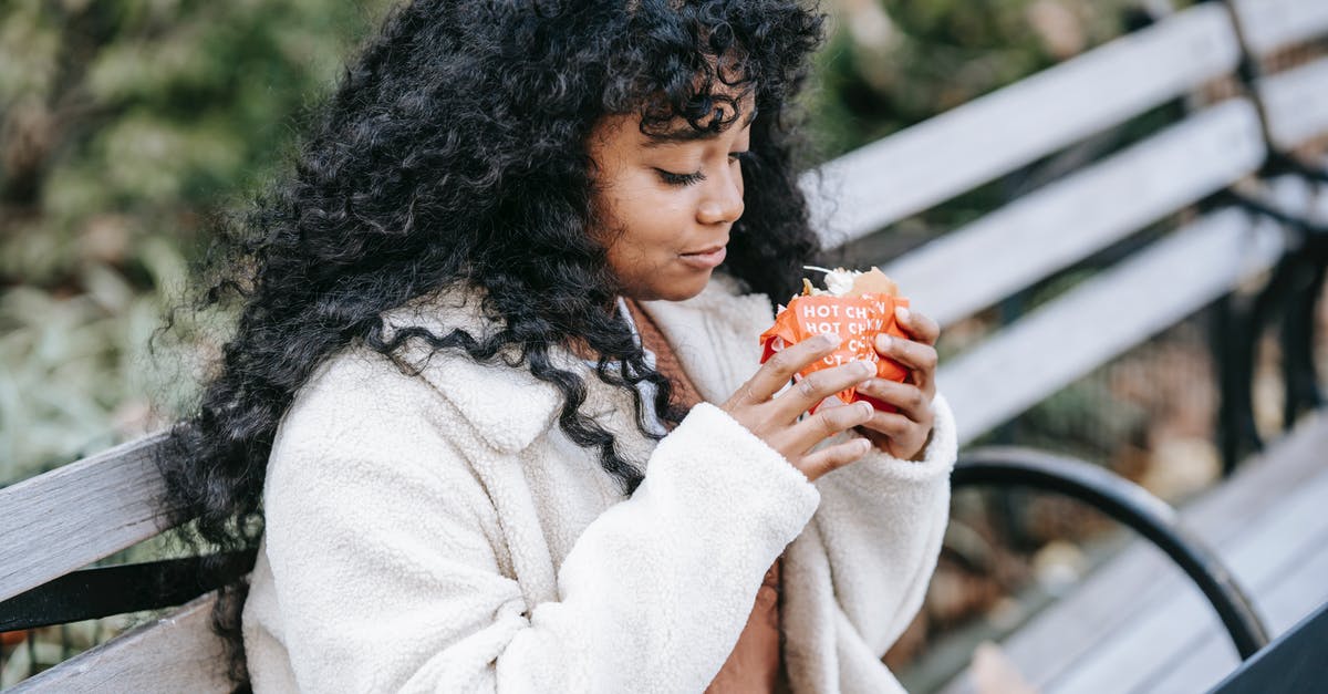 How long is cooked hamburger able to sit in a crockpot? - Content black woman eating tasty burger on park bench How long is cooked hamburger able to sit in a crockpot? - Content black woman eating tasty burger on park bench