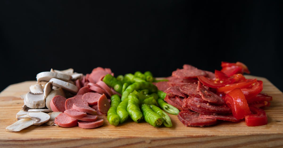 How long to cook pork chops sous vide? - Pizza ingredients placed on wooden cutting board How long to cook pork chops sous vide? - Pizza ingredients placed on wooden cutting board