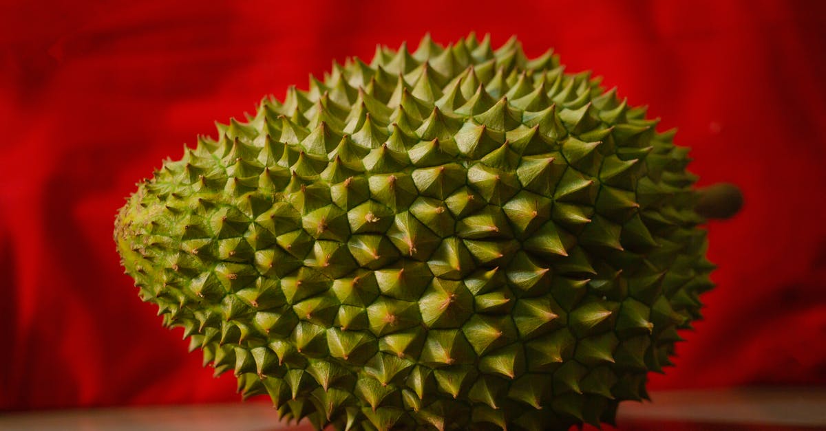 How long will durian smell linger? - Fresh prickly durian on red background How long will durian smell linger? - Fresh prickly durian on red background