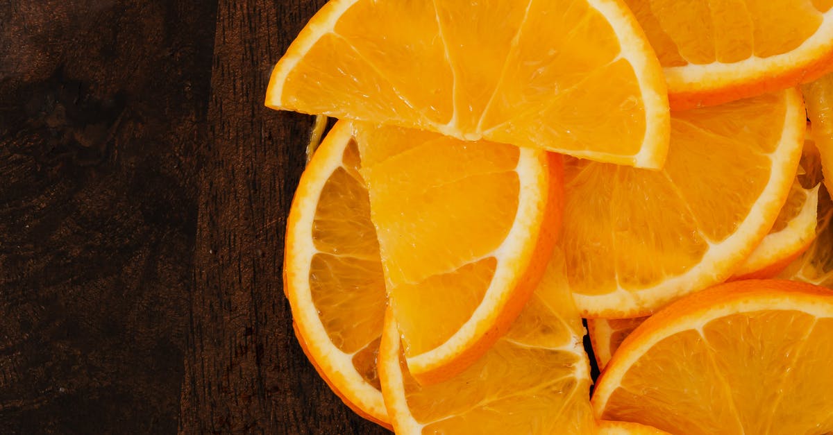 How long will my homemade marinade with orange juice last? - Top view slices of fresh oranges on wooden background How long will my homemade marinade with orange juice last? - Top view slices of fresh oranges on wooden background